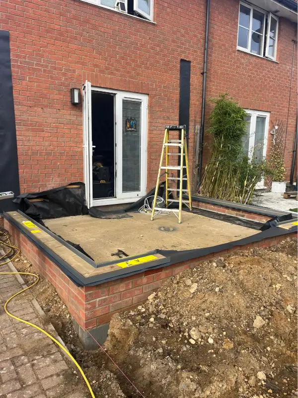 Prepared brick base and concrete floor slab for a HUP! home extension in Norwich